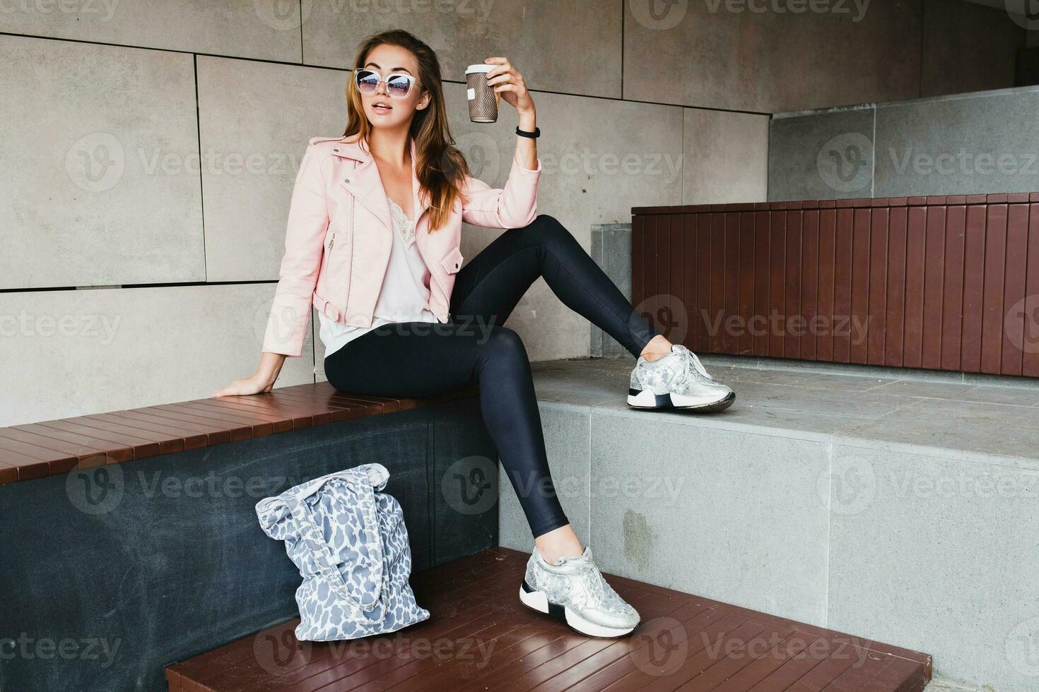 young beautiful stylish hipster woman in pink leather jacket photo