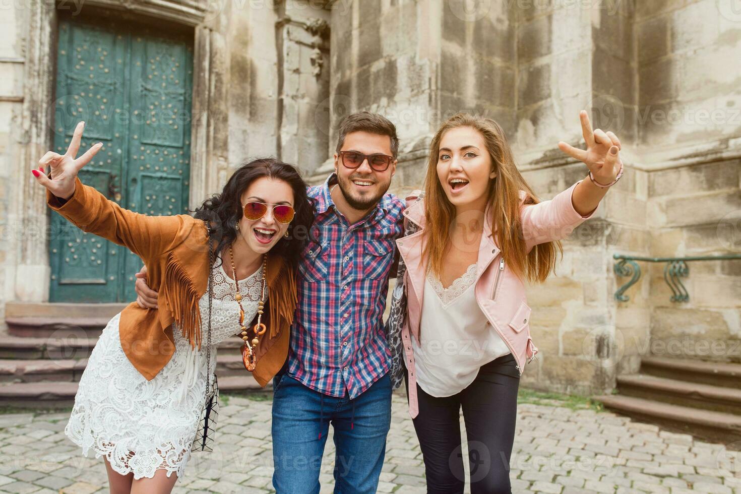 young hipster company of friends traveling, vintage style, europe vacation photo