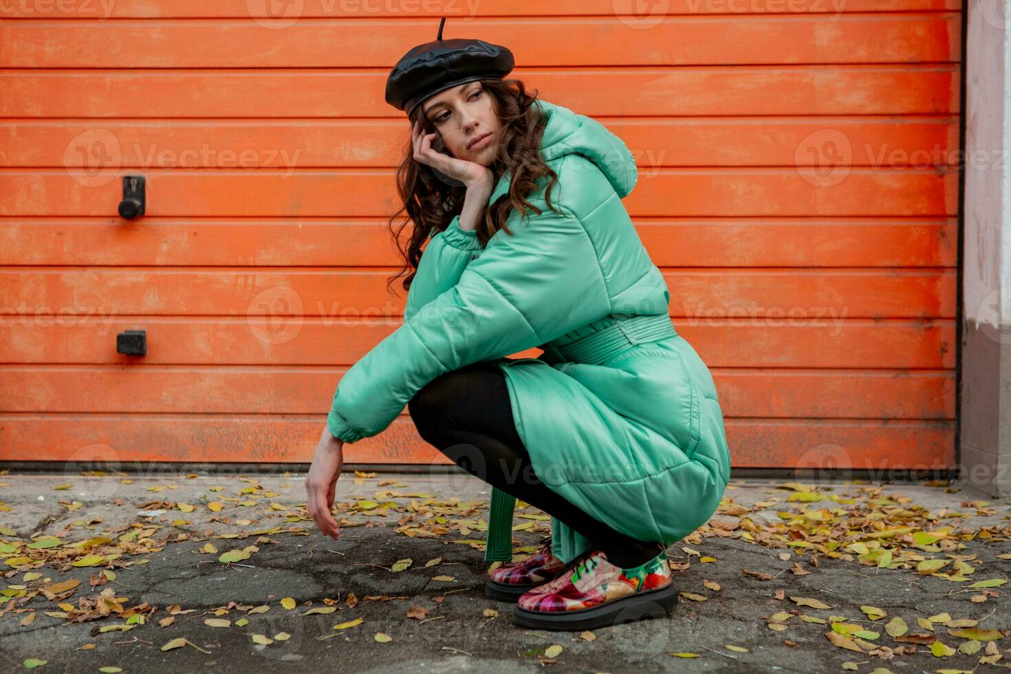 stylish woman in winter autumn fashion trend puffer coat photo