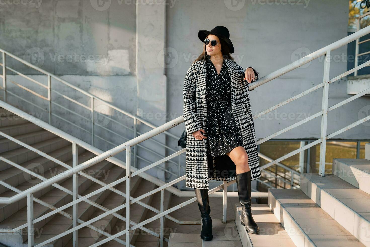 attractive young woman walking in autumn wearing coat photo
