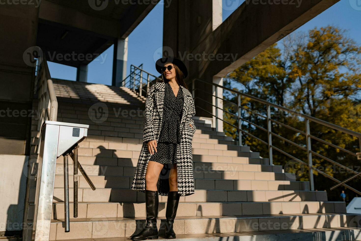attractive young woman walking in autumn wearing coat photo