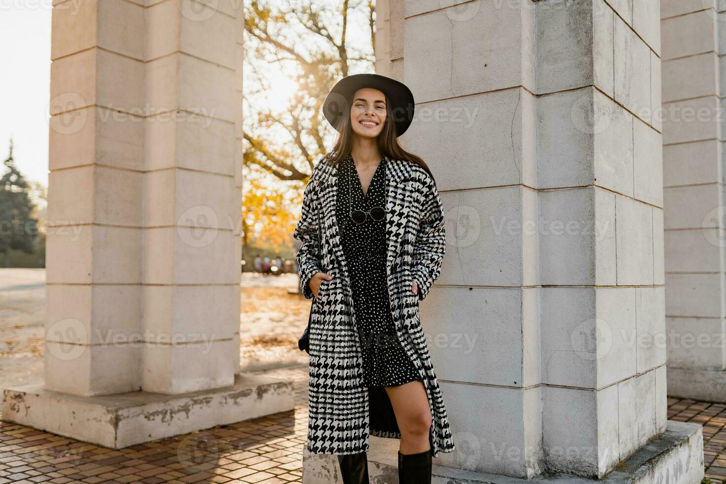 attractive young woman walking in autumn wearing coat photo