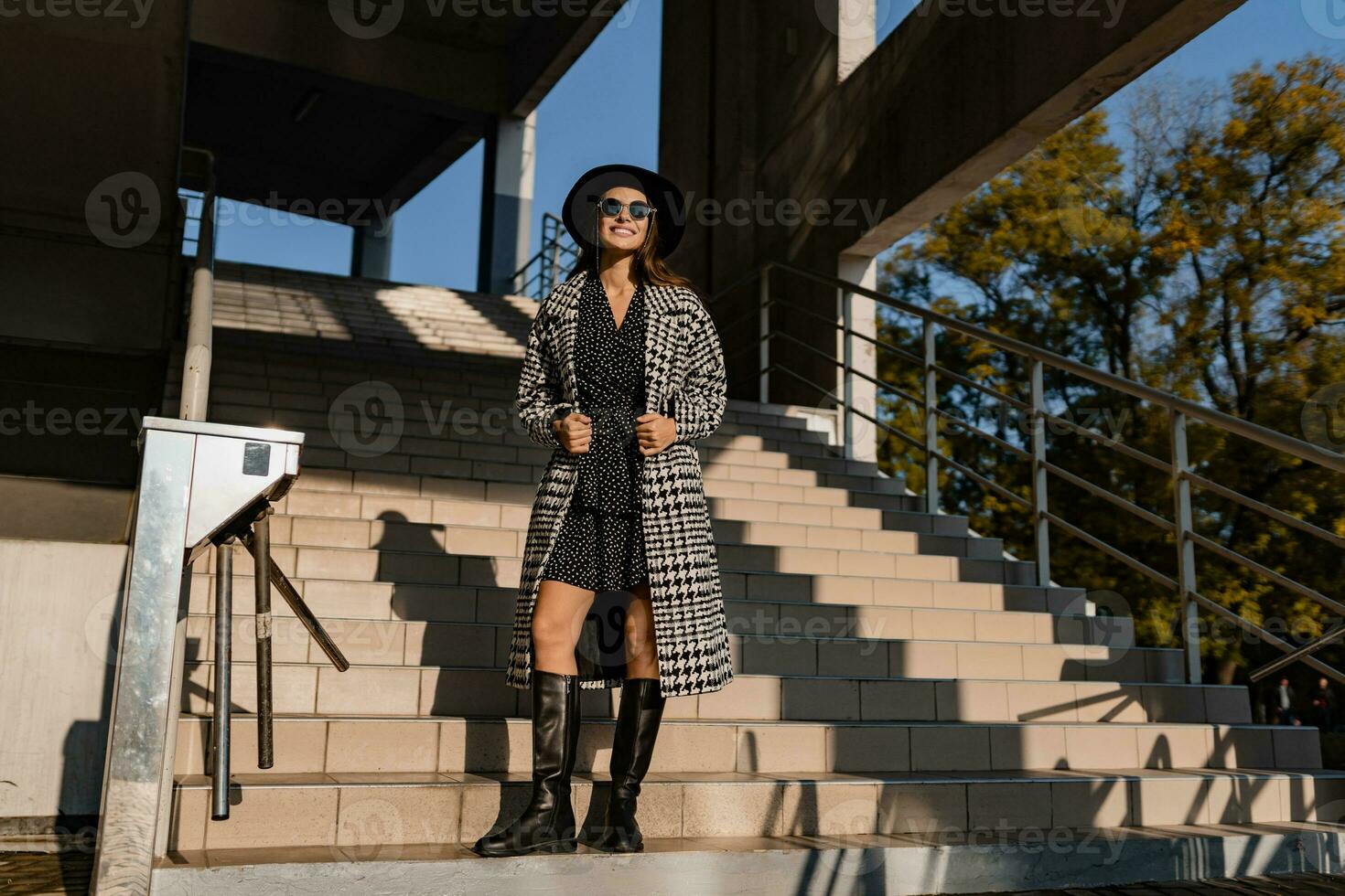 attractive young woman walking in autumn wearing coat photo