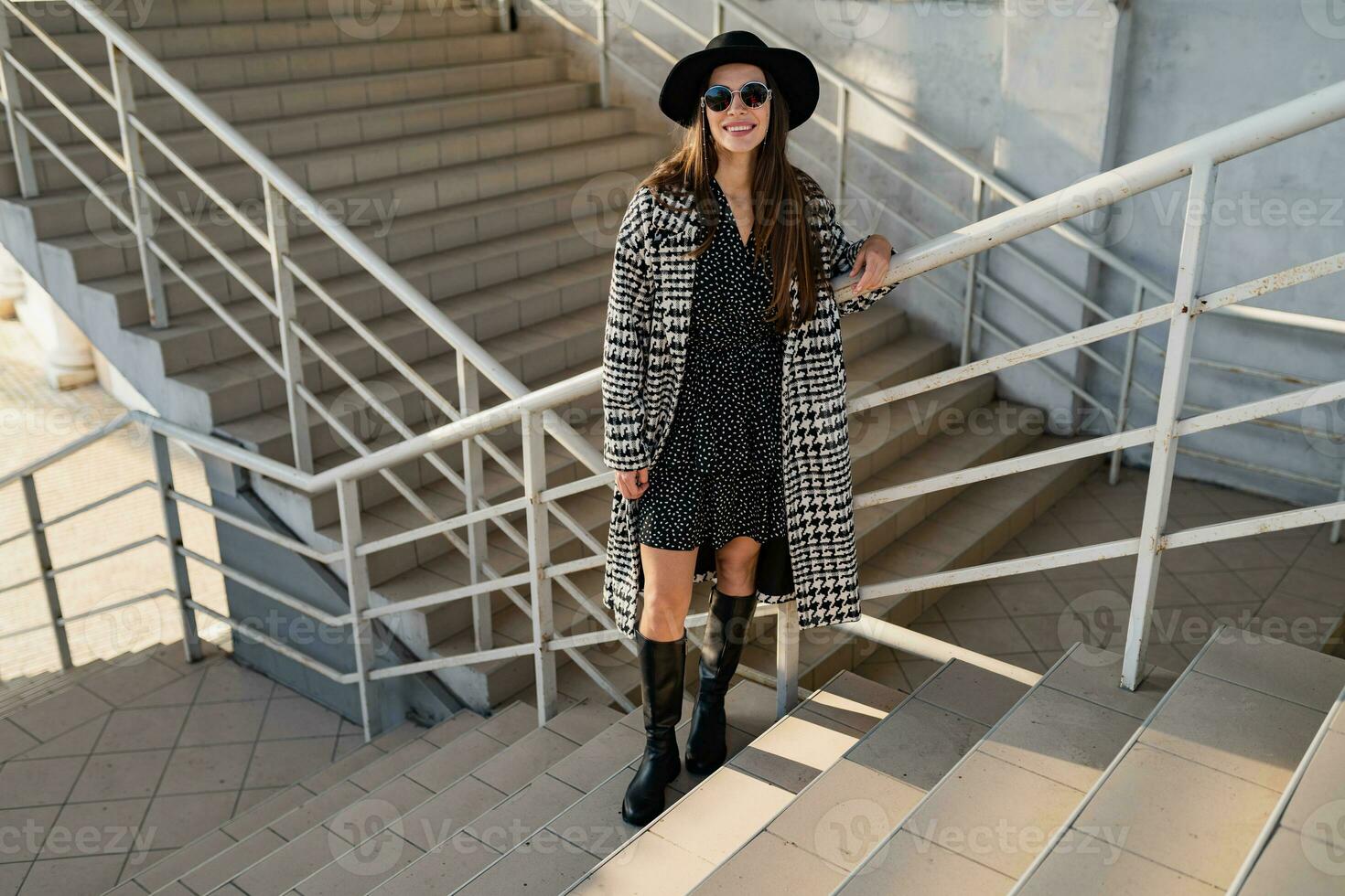 attractive young woman walking in autumn wearing coat photo