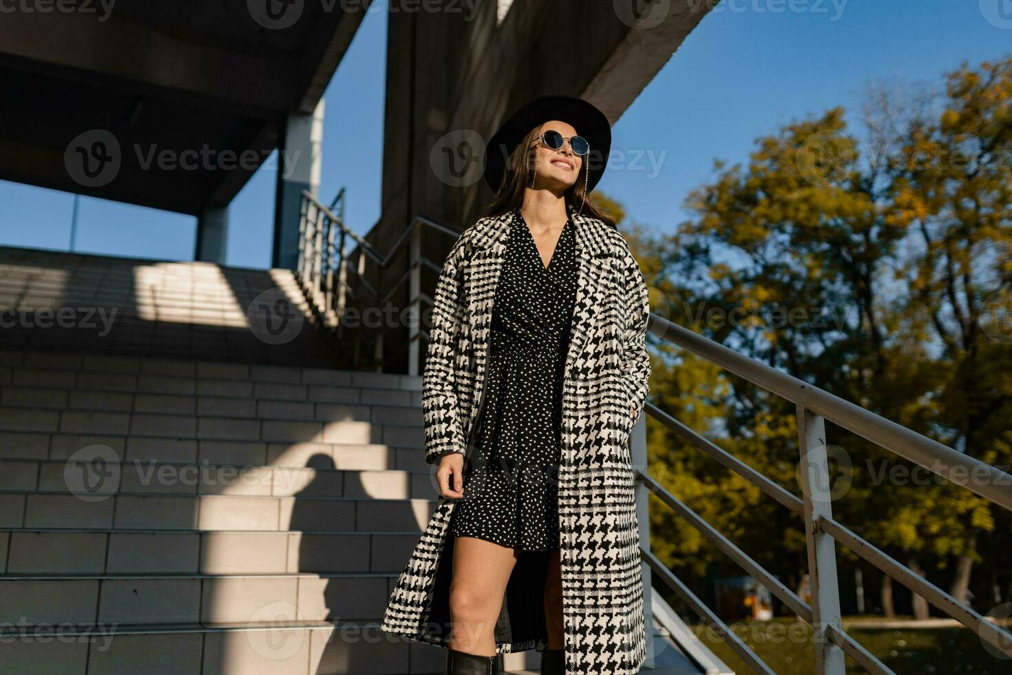 attractive young woman walking in autumn wearing coat photo