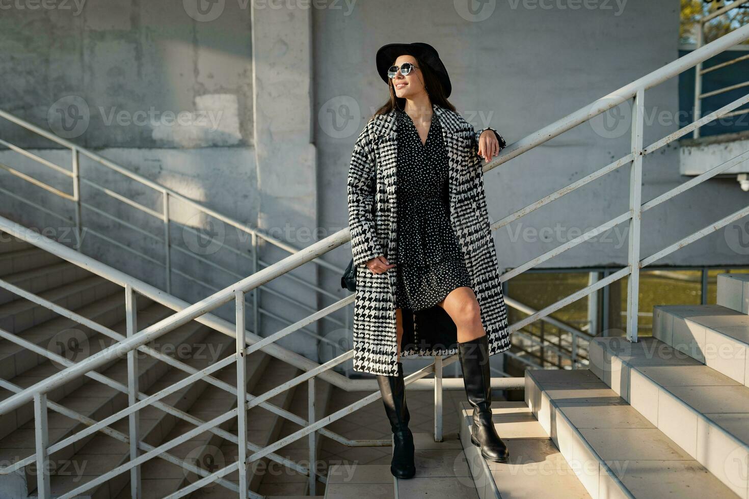 attractive young woman walking in autumn wearing coat photo