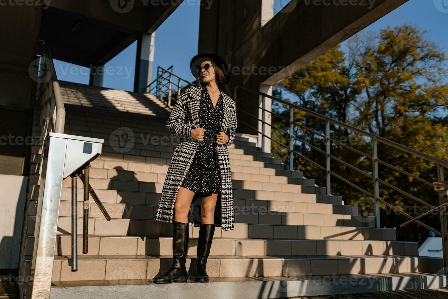 attractive young woman walking in autumn wearing coat photo