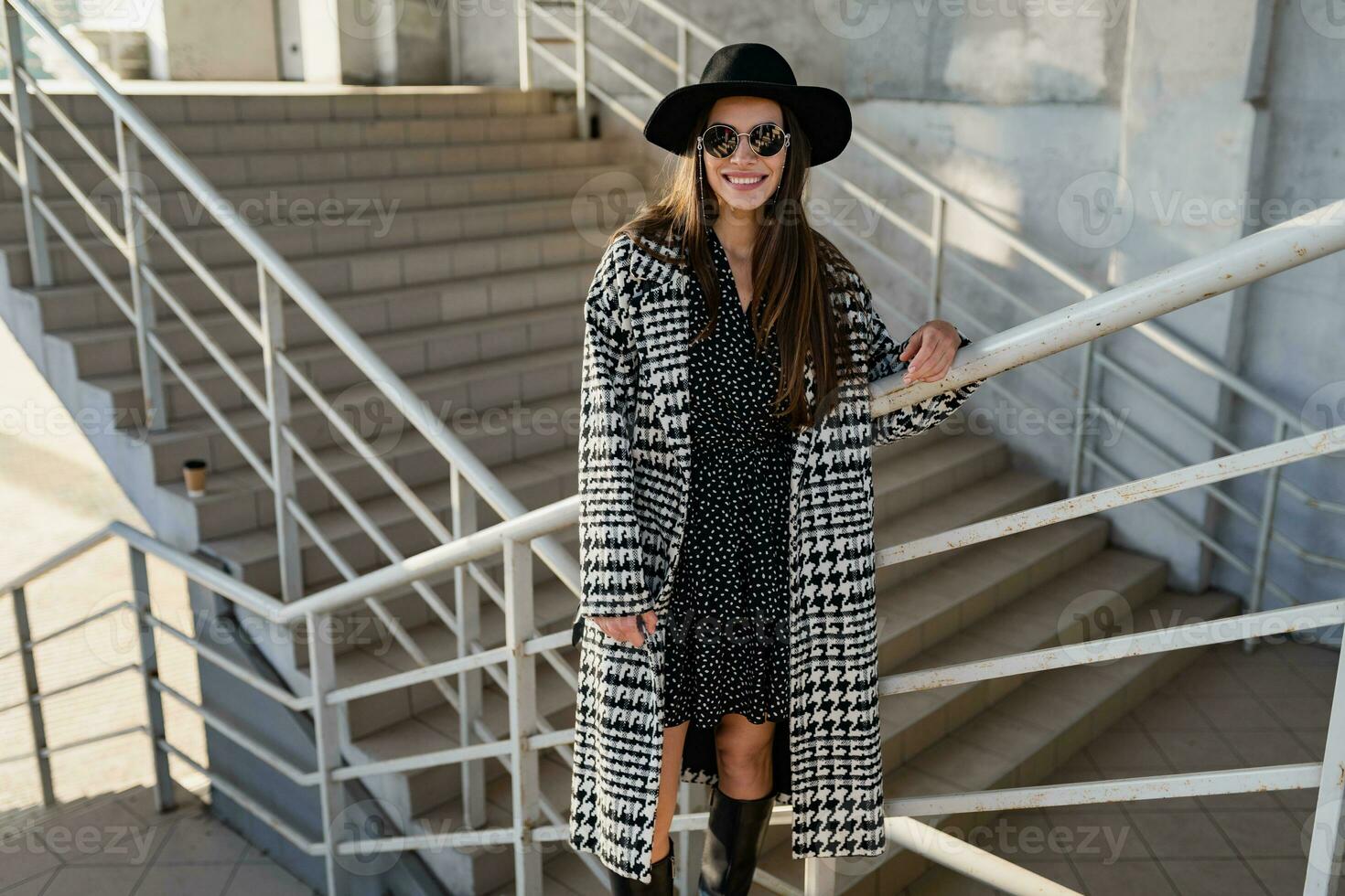 attractive young woman walking in autumn wearing coat photo