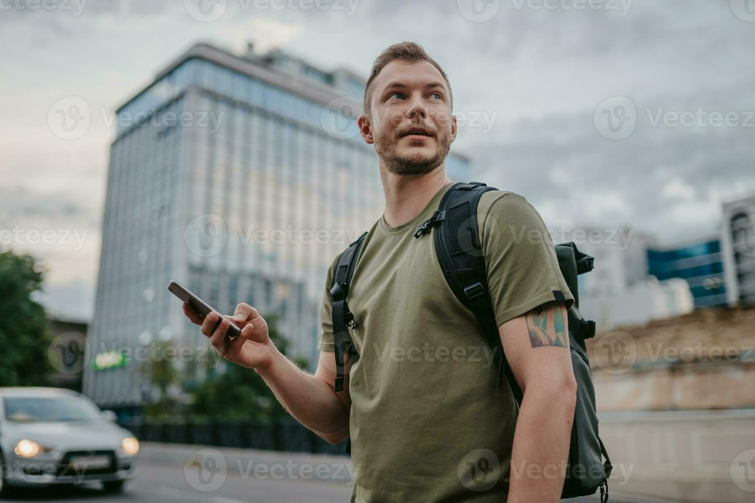 handsome hipster man walking in street photo