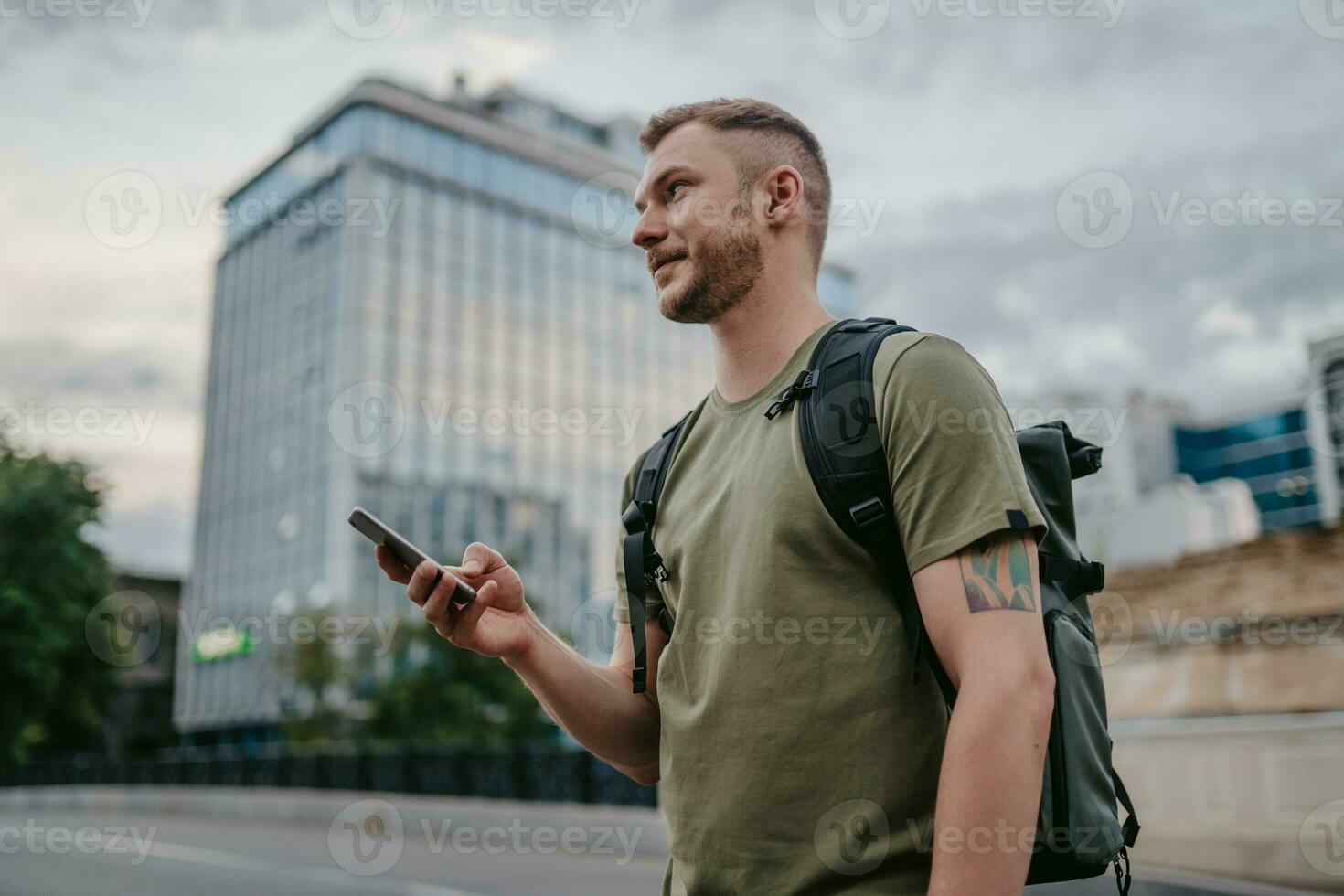 handsome hipster man walking in street photo