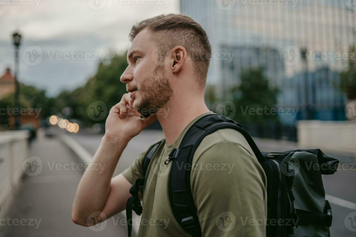 handsome hipster man walking in street photo