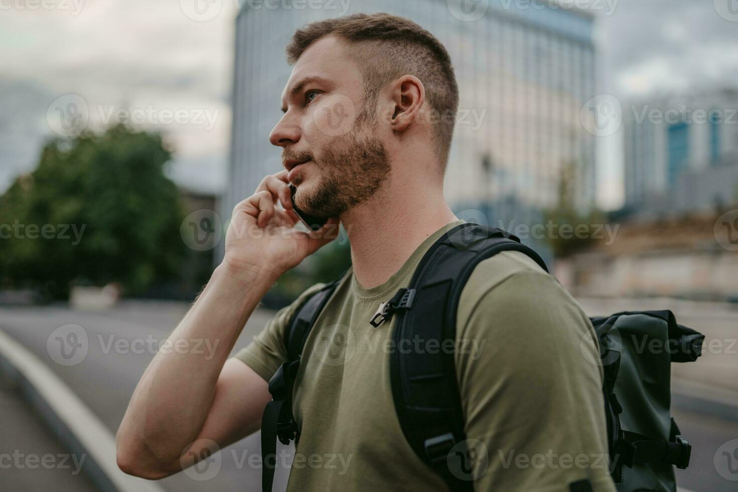 handsome hipster man walking in street photo