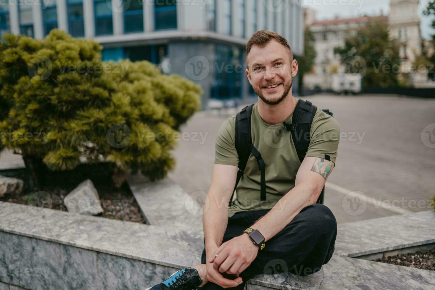 handsome hipster man walking in street photo