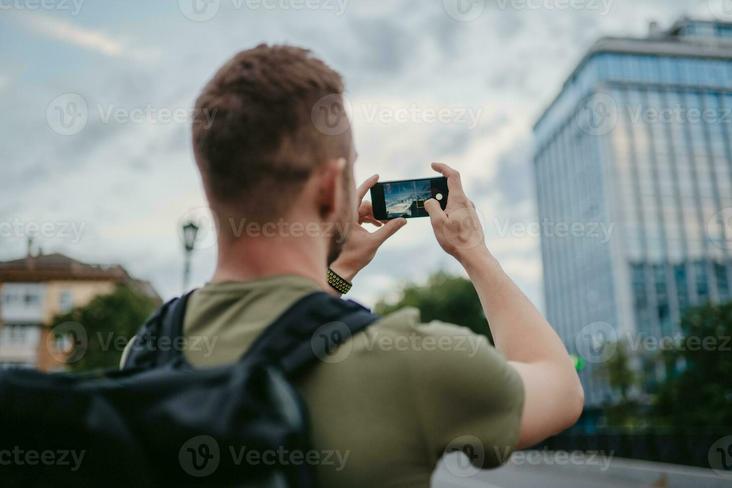 handsome hipster man walking in street photo