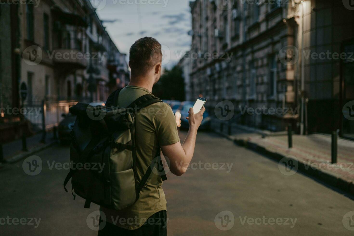 handsome hipster man walking in street photo
