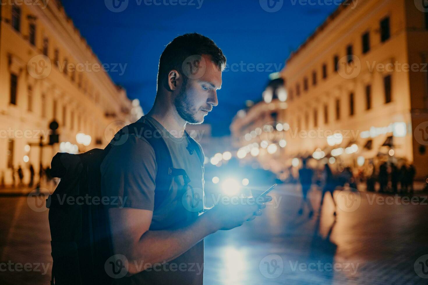 handsome hipster man walking in street photo