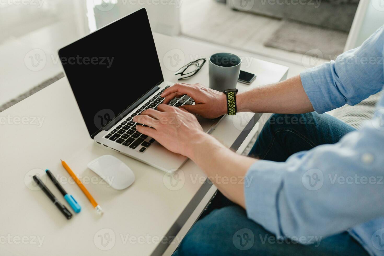 flat lay view from above on table workplace close-up man hands at home working photo