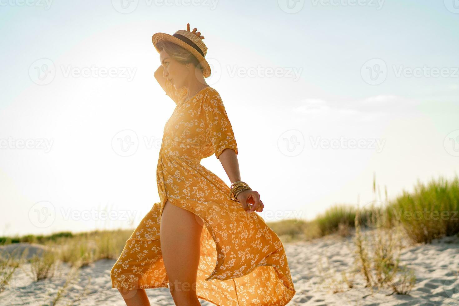 stylish attractive slim smiling woman on beach in summer style fashion trend outfit photo