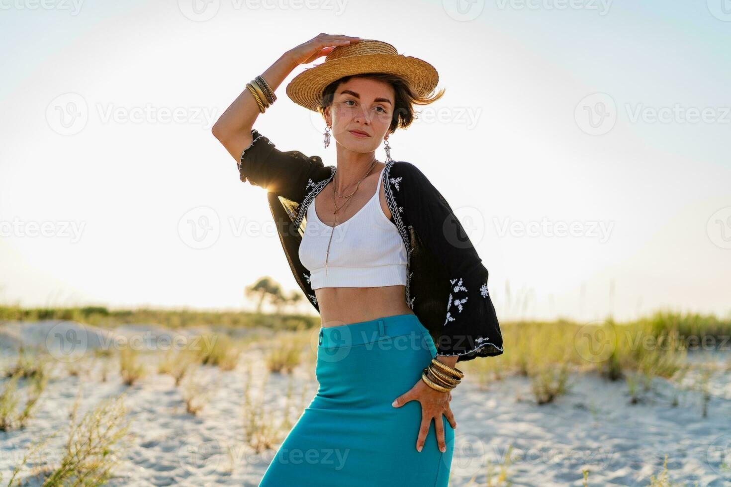 stylish attractive woman on beach in summer style fashion trend outfit happy having fun photo
