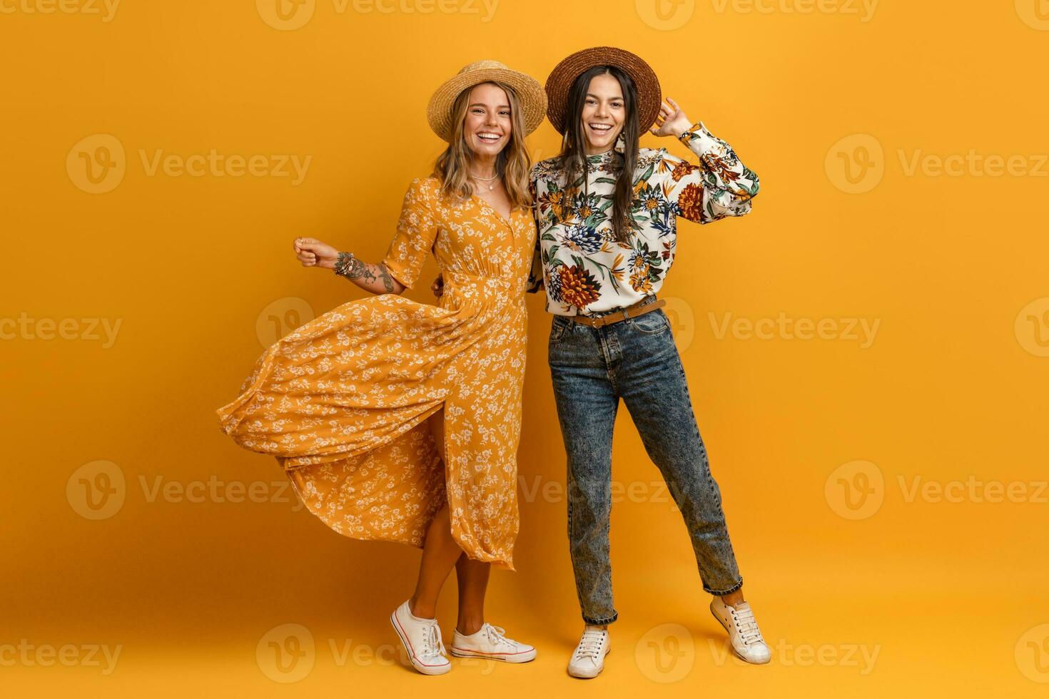 two beautiful attractive stylish women friends having fun together photo