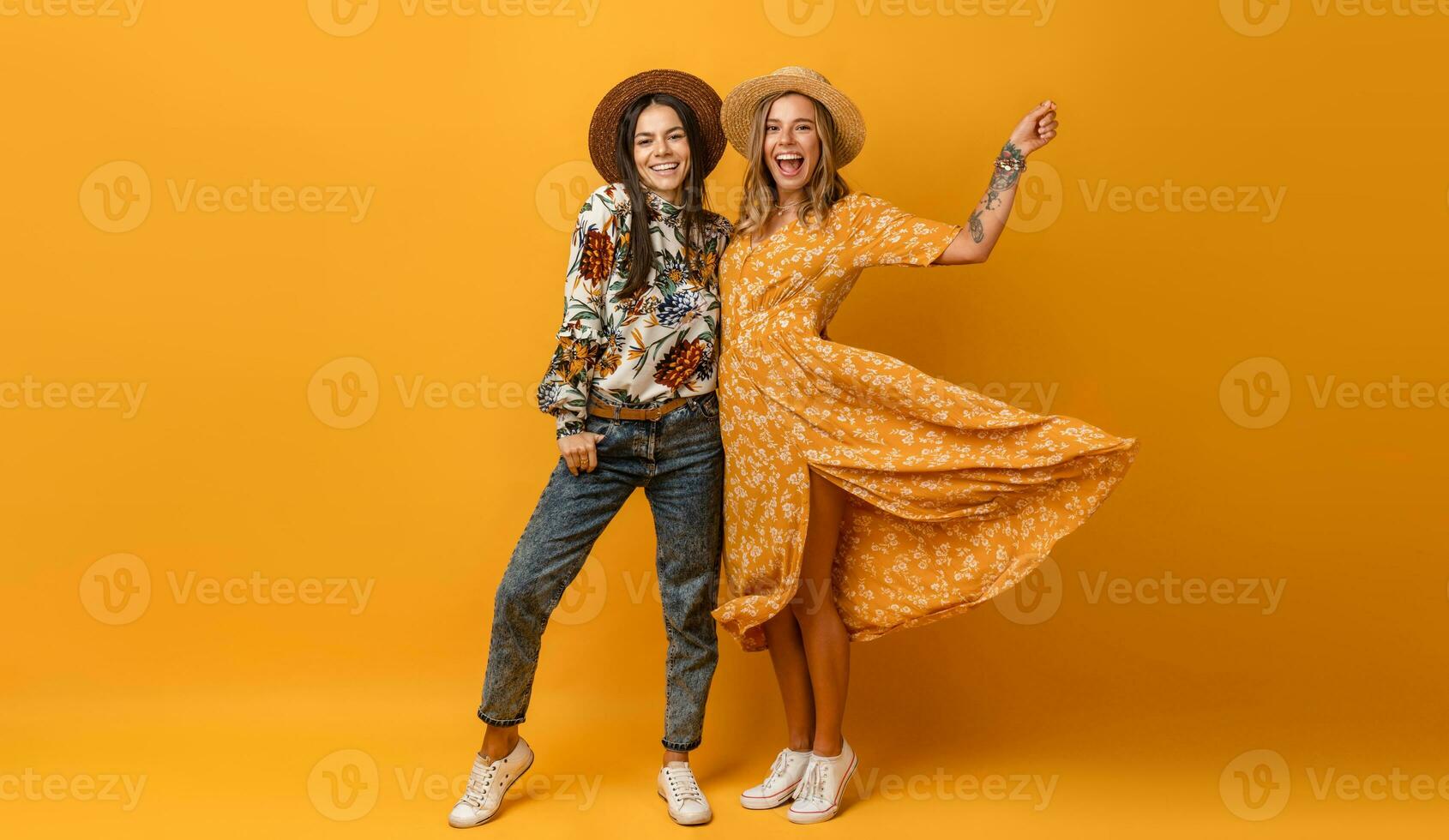 two beautiful attractive stylish women friends having fun together photo