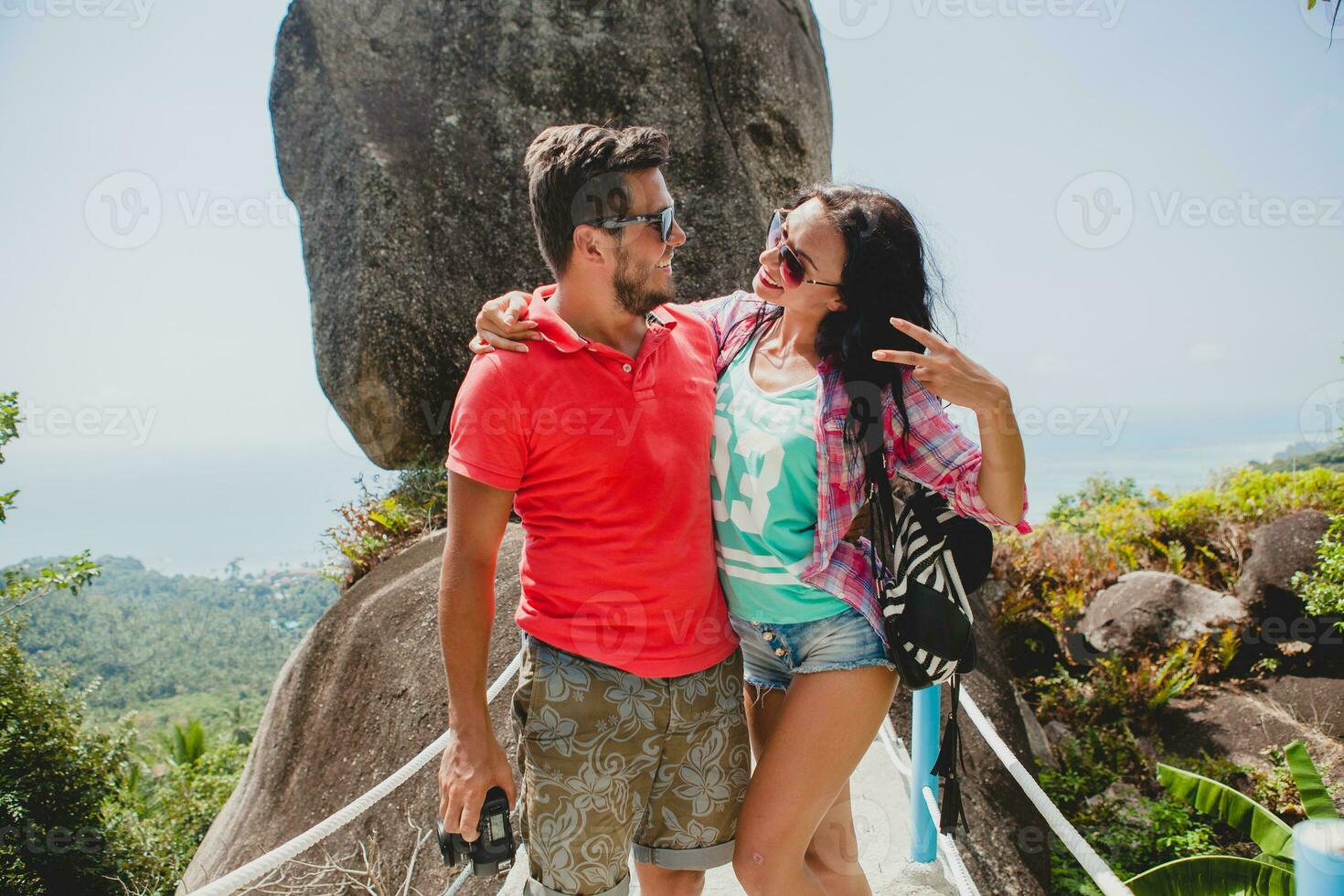 young happy hipster couple in love traveling around world photo