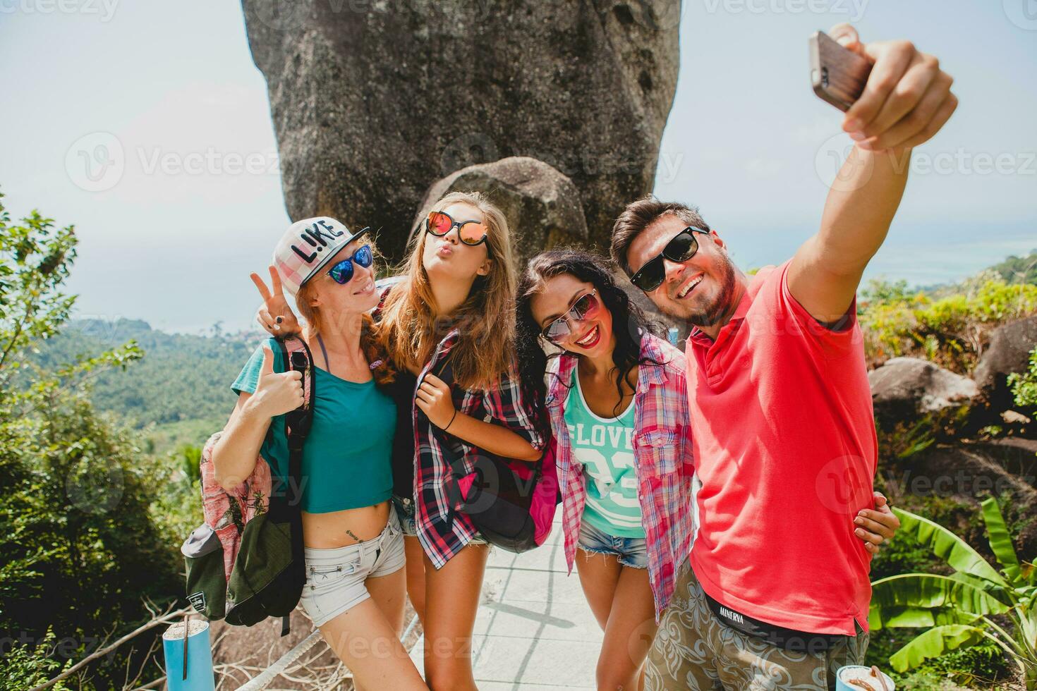 happy hipster company of friends traveling around world photo