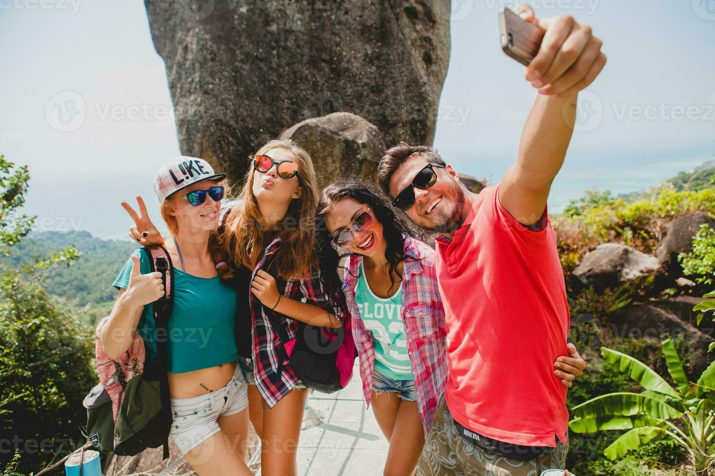 happy hipster company of friends traveling around world photo