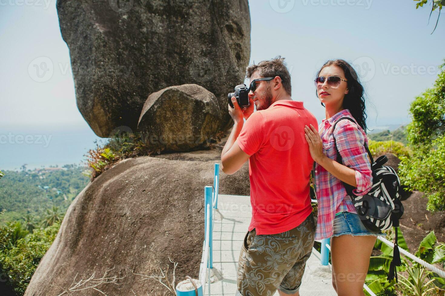 young happy hipster couple in love traveling around world photo