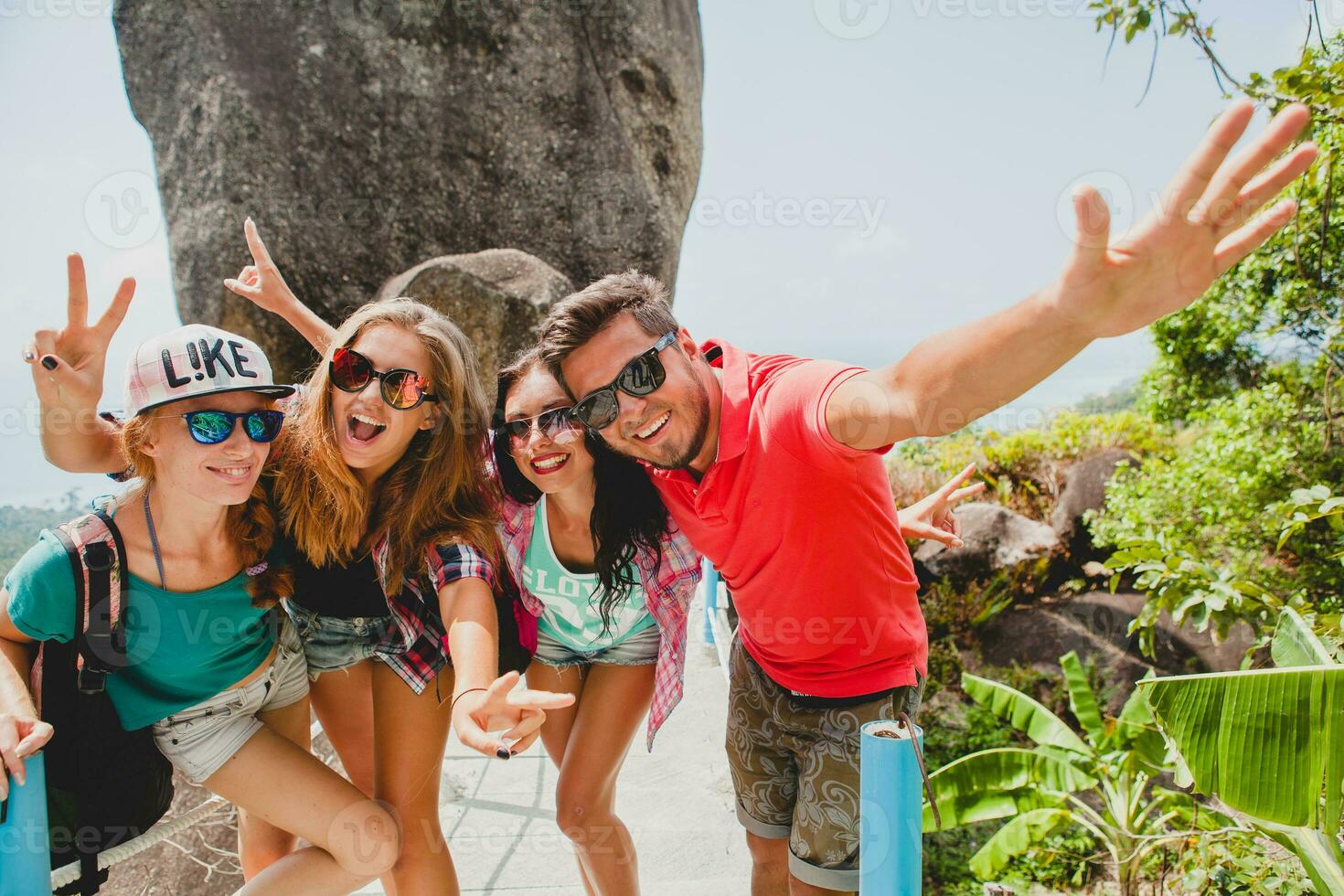 happy hipster company of friends traveling around world photo