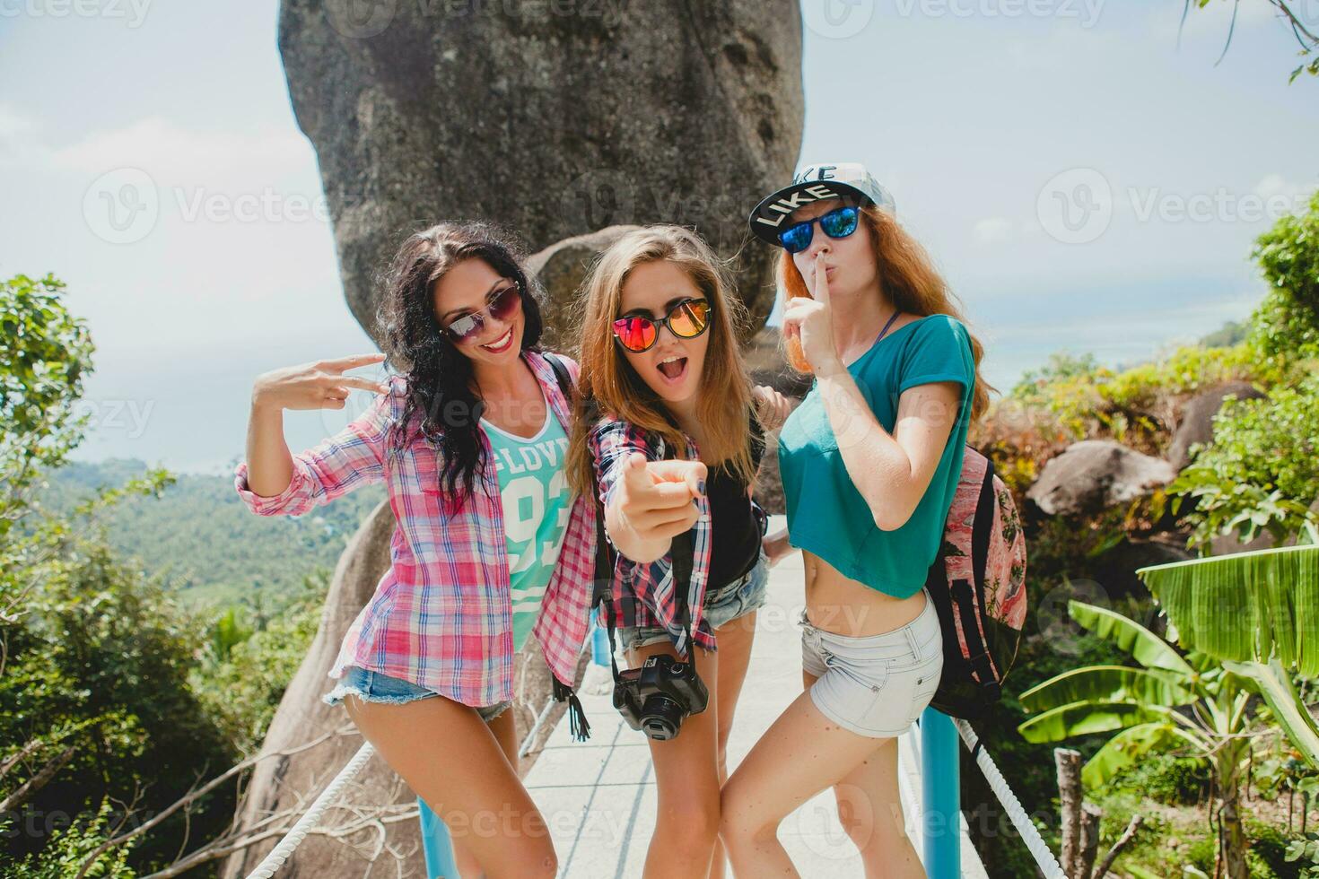 happy hipster company of friends traveling around world photo