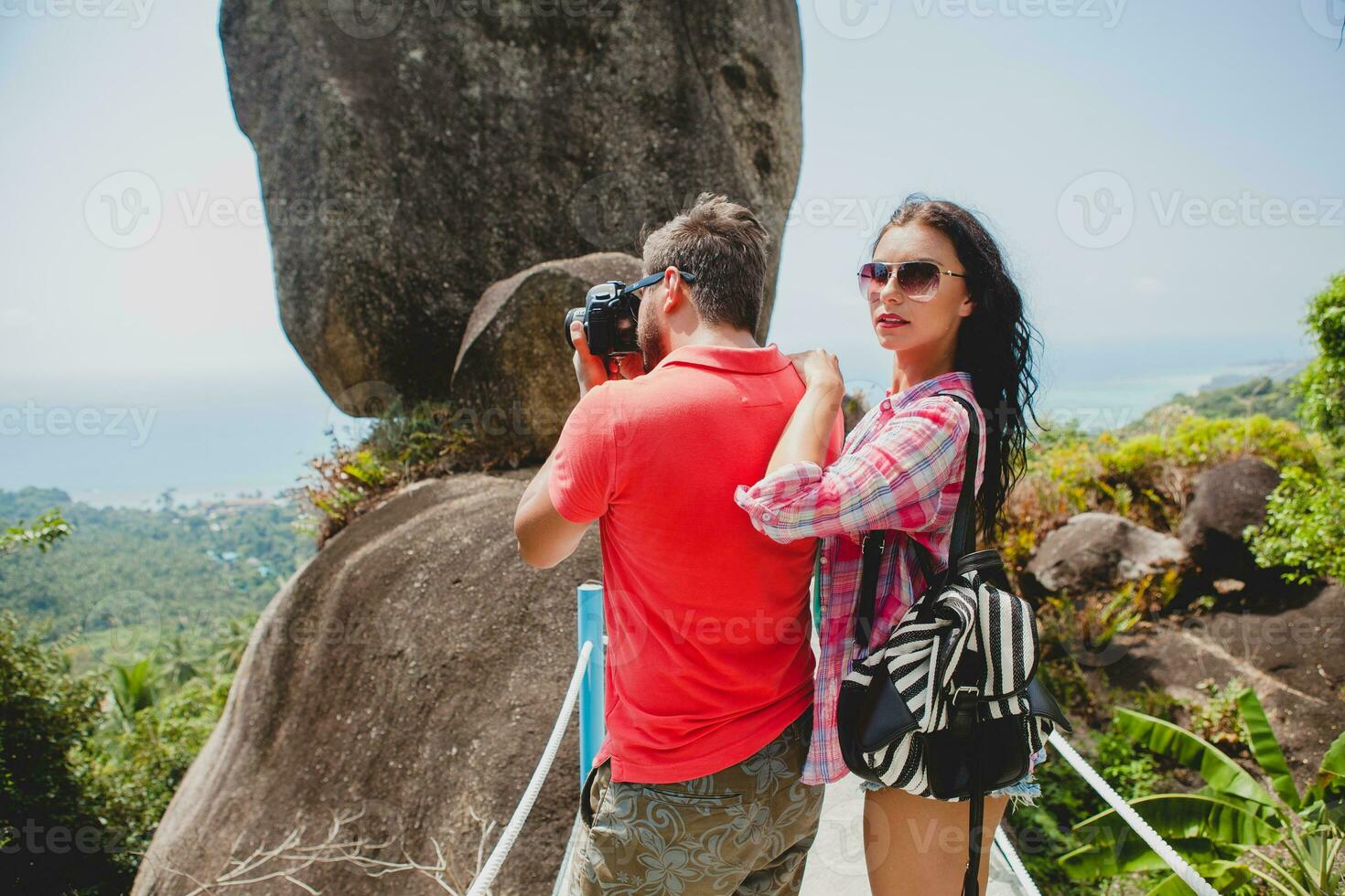 young happy hipster couple in love traveling around world photo