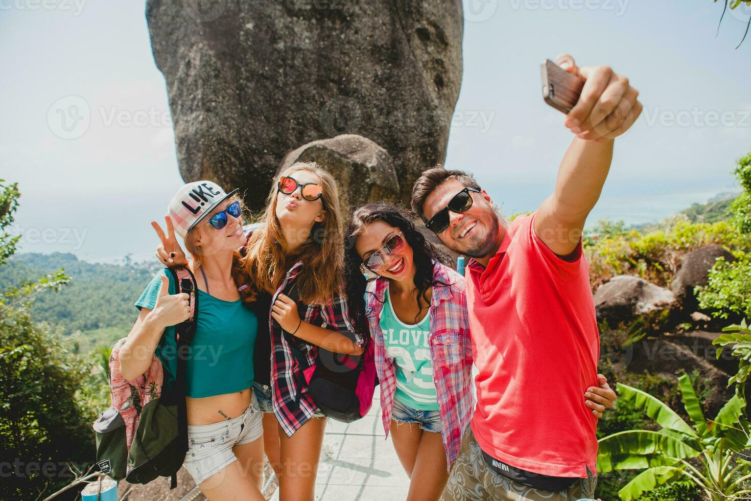 happy hipster company of friends traveling around world photo