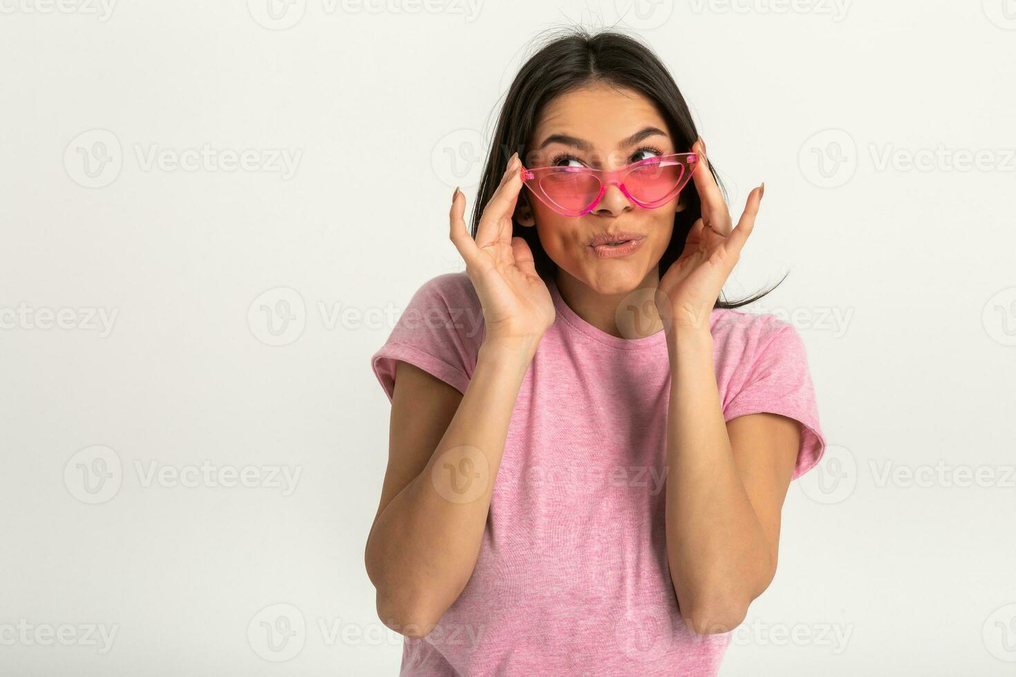 attractive woman in pink t-shirt and sunglasses photo