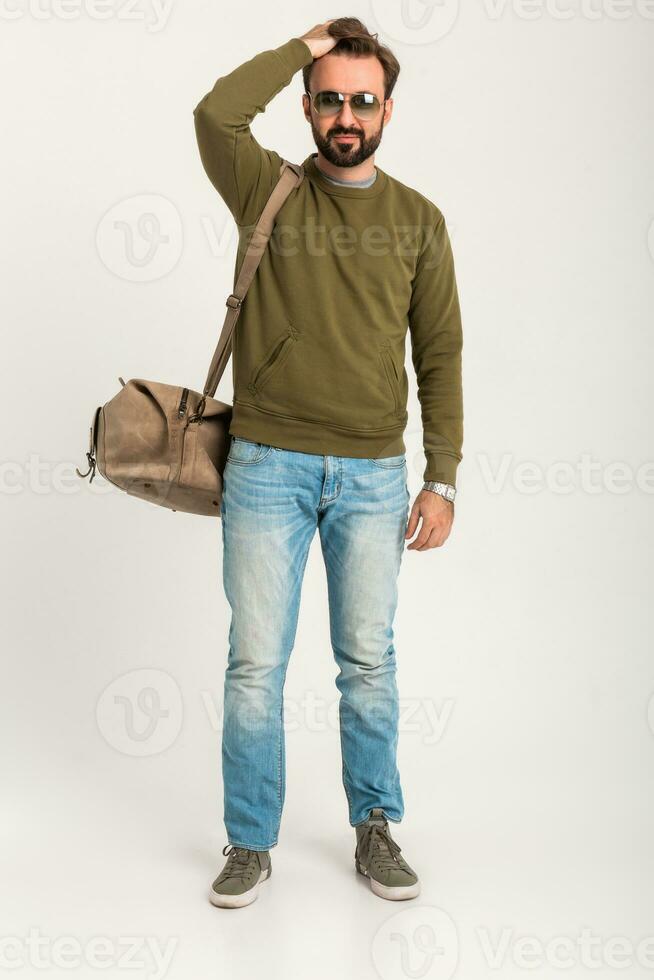 attractive stylish man traveler standing with bag photo