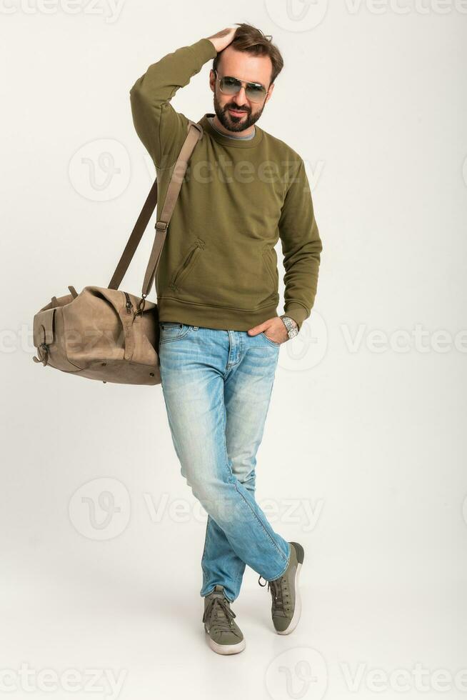 attractive stylish man traveler standing with bag photo