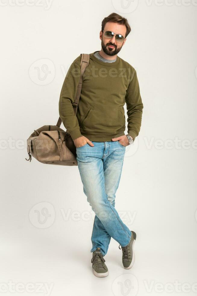 attractive stylish man traveler standing with bag photo