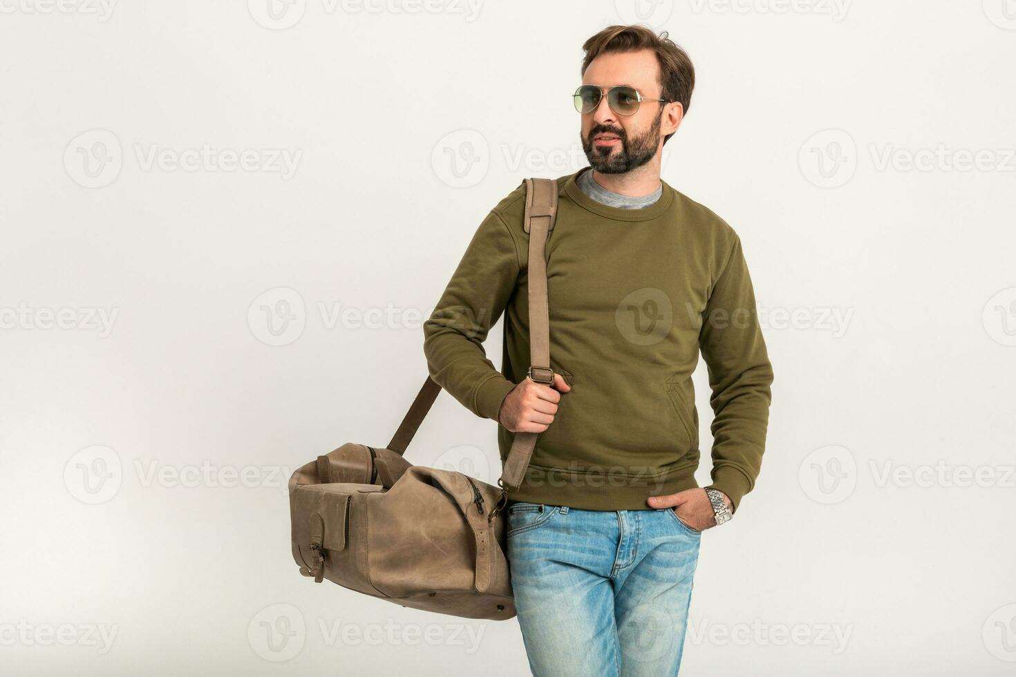 attractive stylish man traveler with bag photo