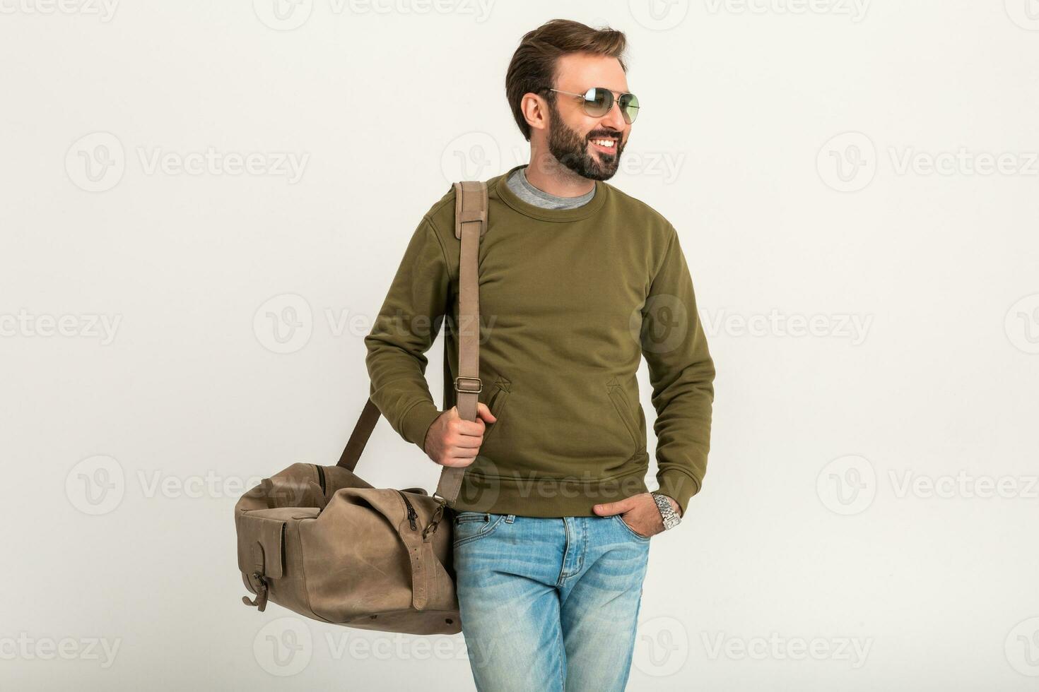 attractive stylish man traveler with bag photo