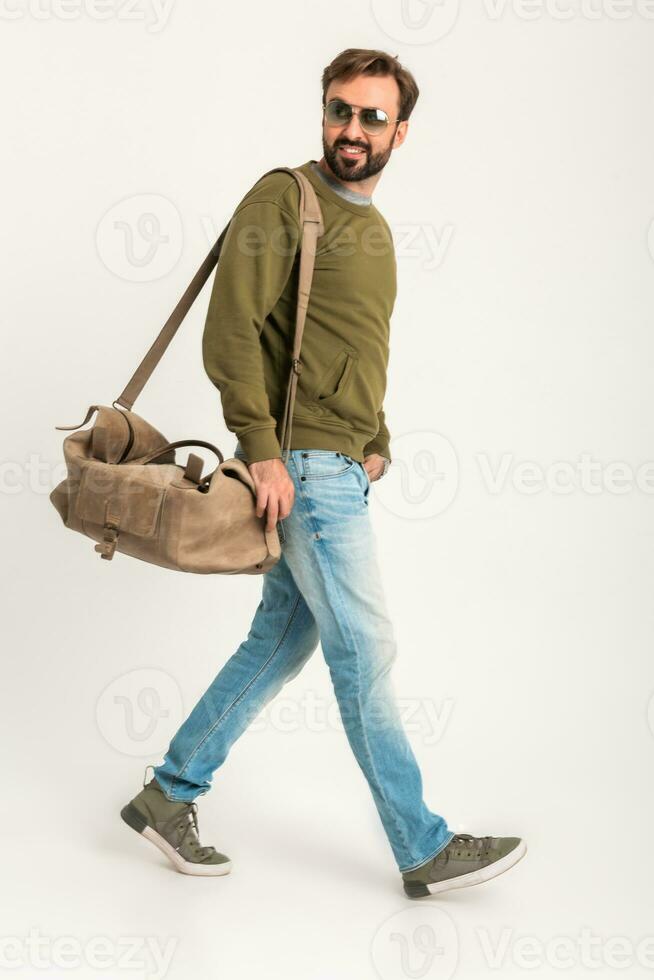 attractive stylish man traveler with bag photo