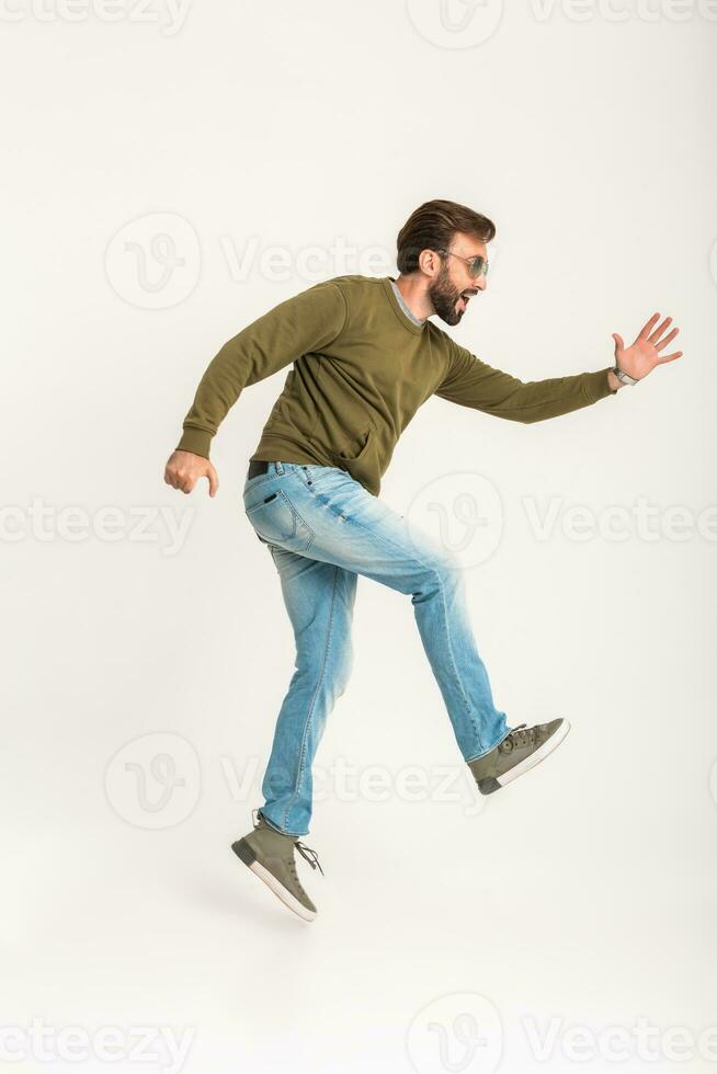 handsome bearded stylish man jumping running photo