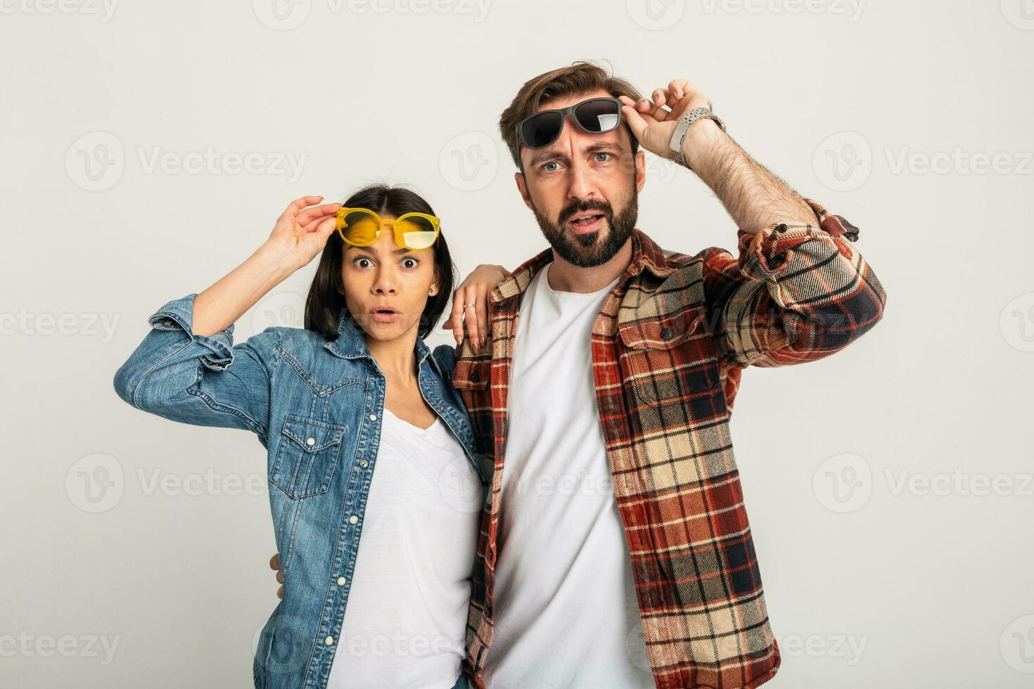 stylish man and woman in casual denim hipster outfit having fun photo