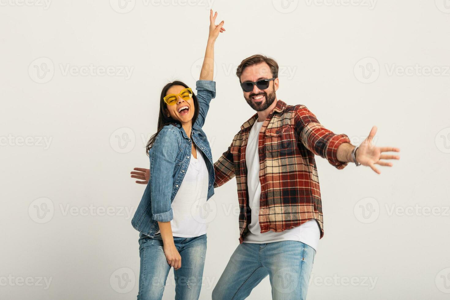 stylish man and woman in casual denim hipster outfit having fun photo