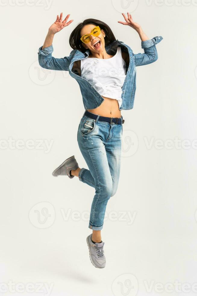 attractive smiling happy woman active jumping photo