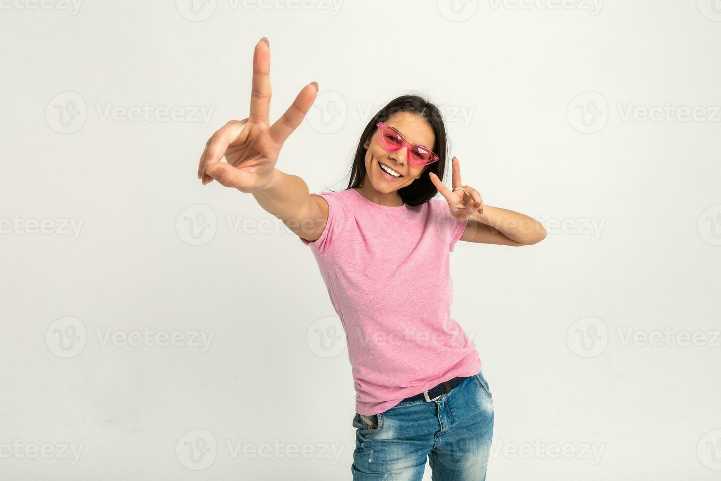 attractive woman in pink t-shirt and sunglasses photo