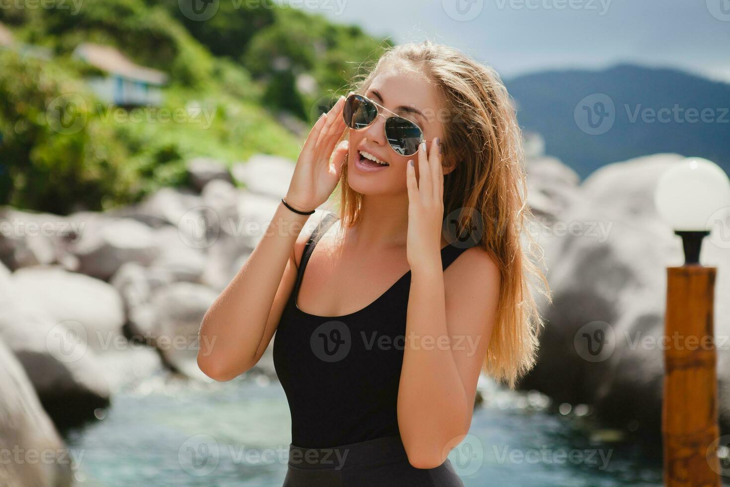 young stylish hipster woman on vacation photo