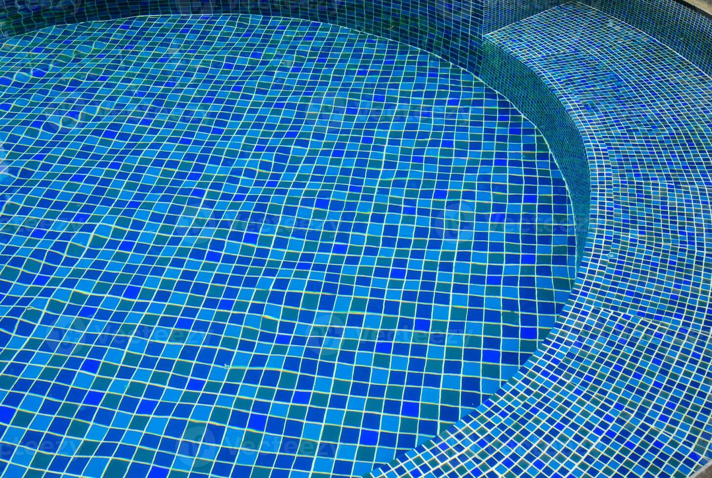 Swimming pool with blue tiled photo