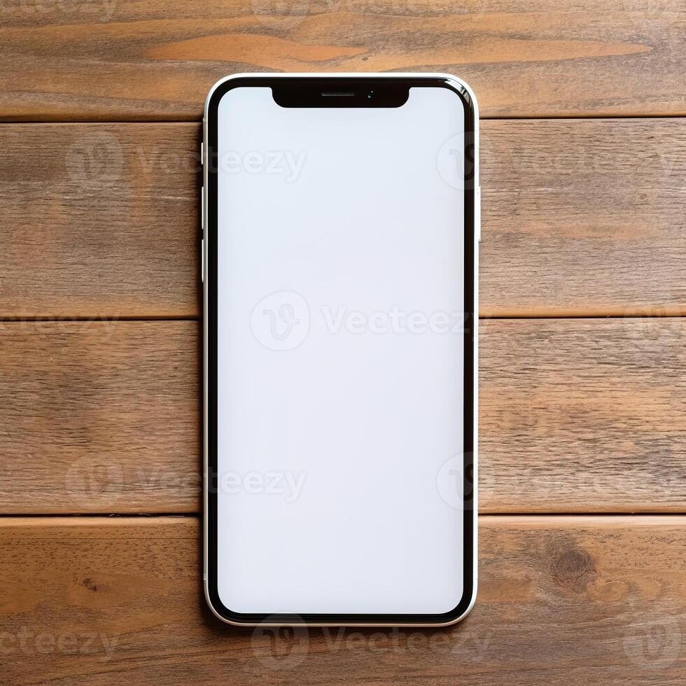 a white screen cell phone on a wooden table photo
