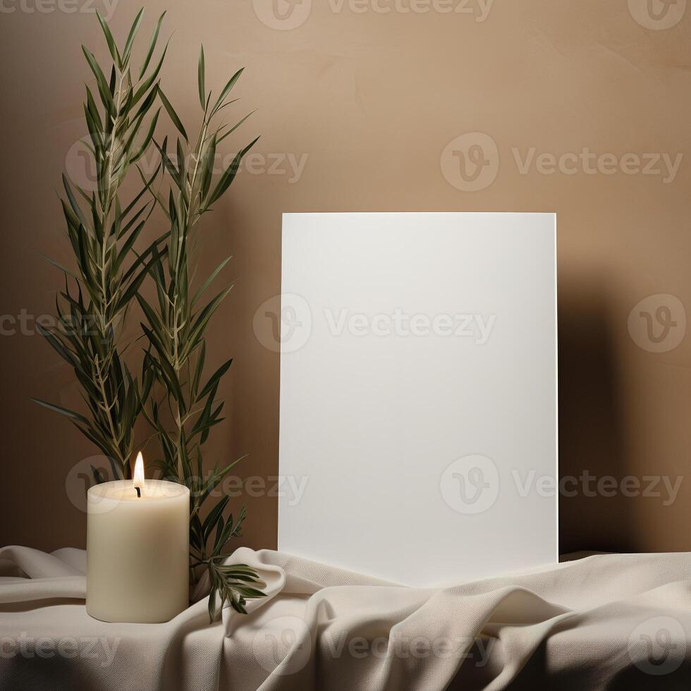 a white sheet of paper next to a candle and a plant photo