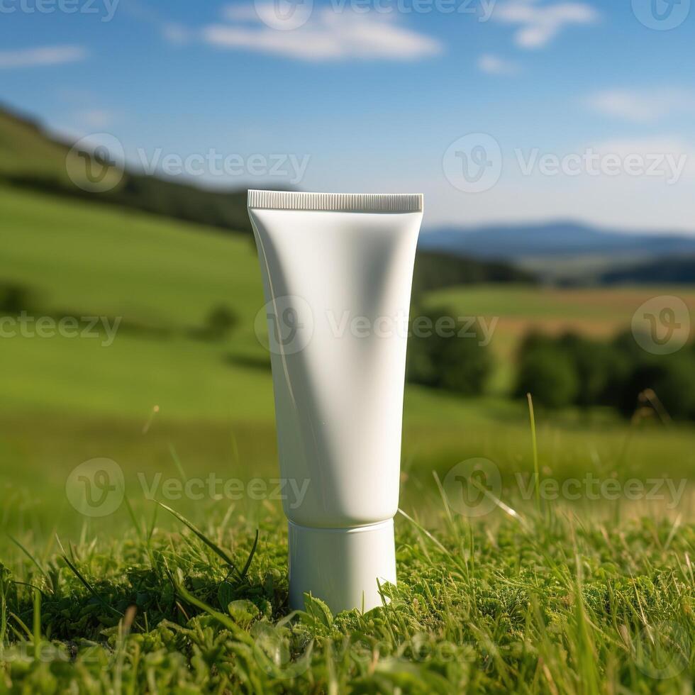 white cream tube on grass on the terrain photo